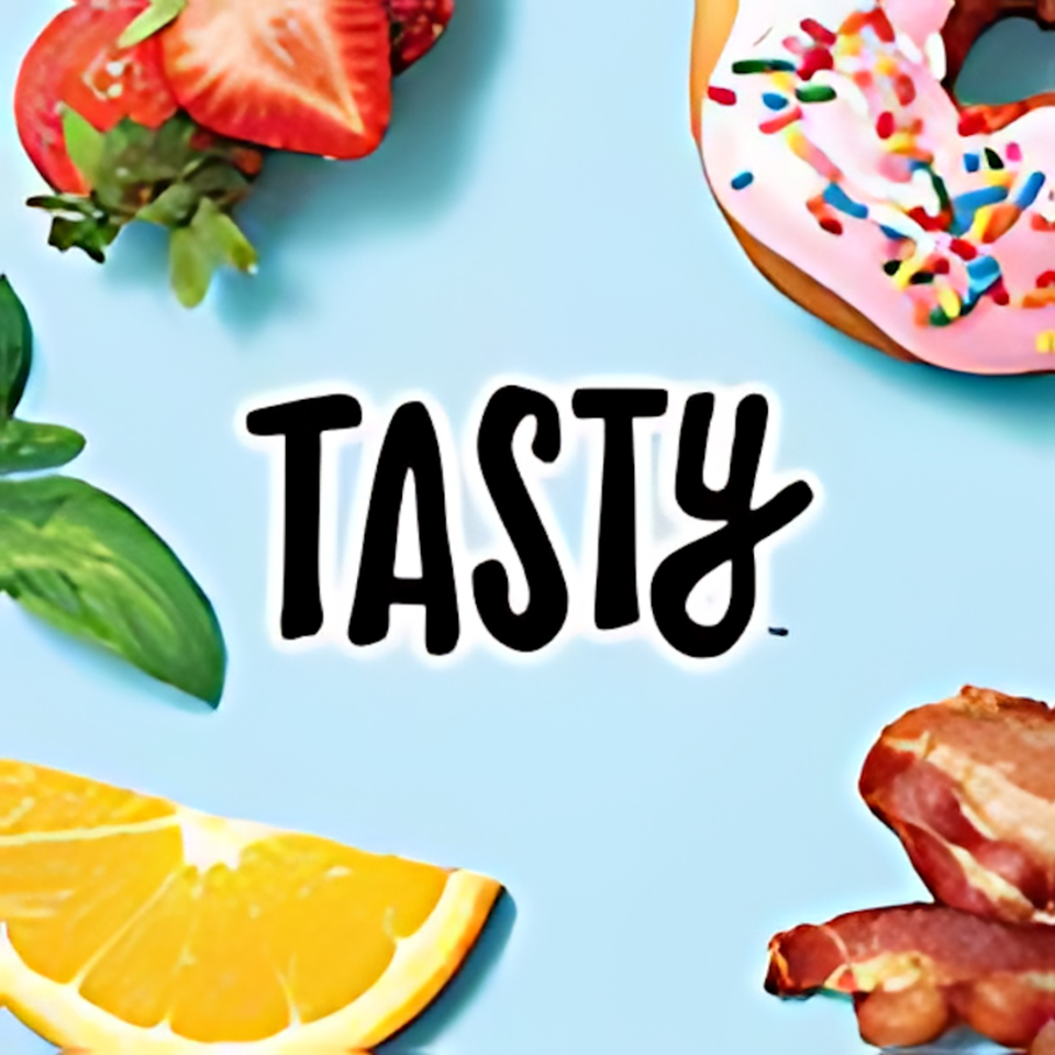 The word "TASTY" centered, surrounded by strawberries, a donut, an orange slice, and bacon.
